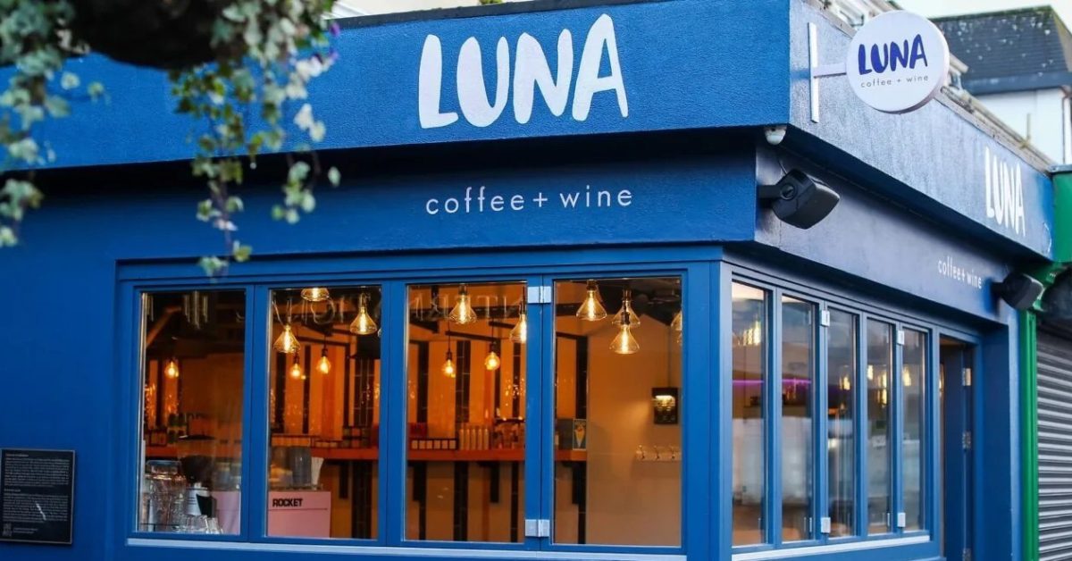 An illustration of the blue LUNA coffee + wine shopfront